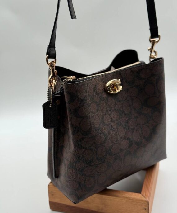 Coach Gofraj baskılı kilitli büzgülü kahve siyah çanta