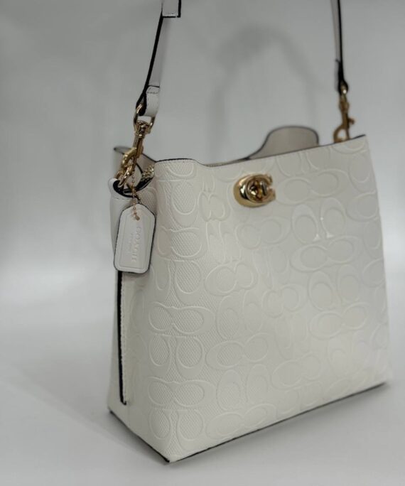 Coach Gofraj baskılı kilitli büzgülü beyaz çanta